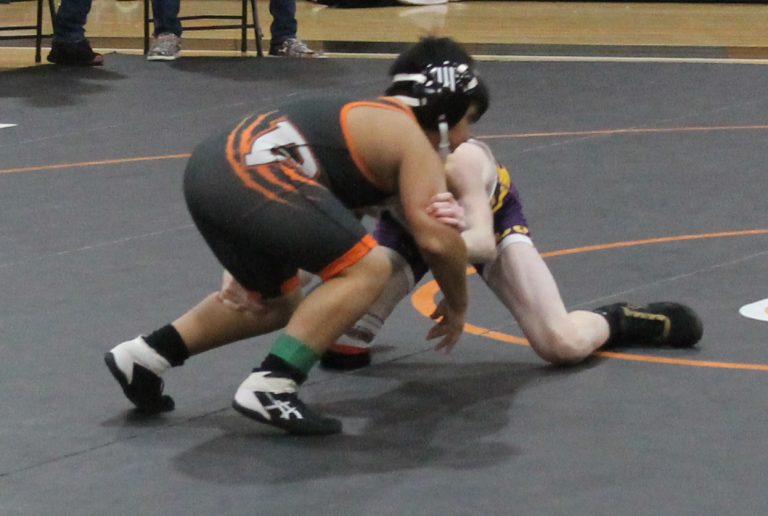 Roger Gil of the BJHS Wrestling team battles with a Farmer of Farmington Central school.