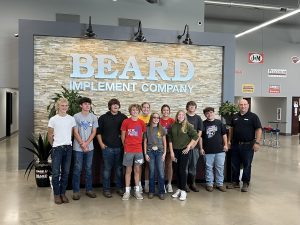 Pictured above, left to right include: Chase Pratt, Brayden Buffington, Wyatt Ratliff, Griffin McClure, Jayce Privia, Tara Taft, Lainey Bartels, Lillian Abbottt, Drake Kennedy, Jonathon Green, and Beard Implement co-owner and manager Kyle Schumacher.