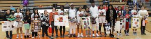 Seniors (L/R) Genesis Perales, Krupa Patel, Josine Mungala, Chrinovie Kondua, Bertille Kayembe, Davina Kanda and Ari Garcia along with their families were honored before the Liberty game.