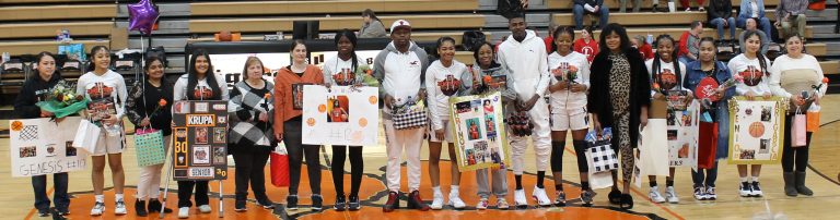 Seniors (L/R) Genesis Perales, Krupa Patel, Josine Mungala, Chrinovie Kondua, Bertille Kayembe, Davina Kanda and Ari Garcia along with their families were honored before the Liberty game.