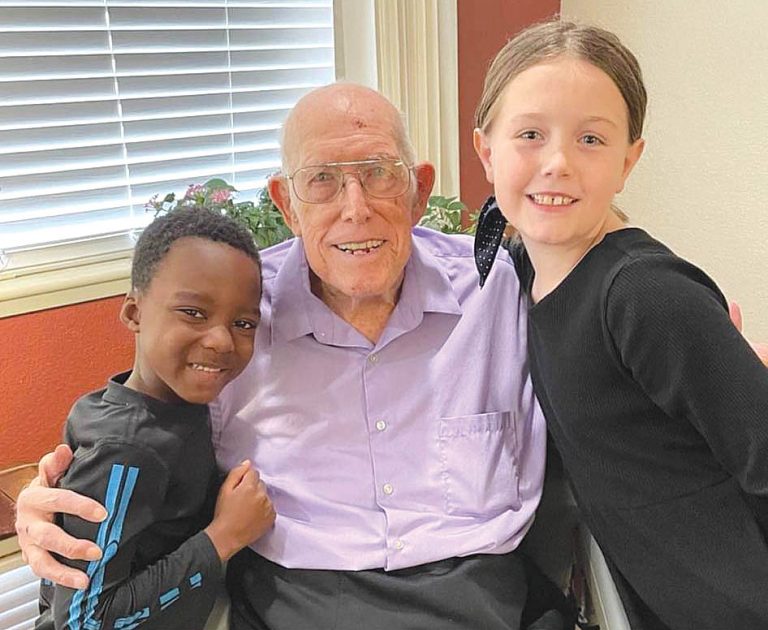 Roy Roberts, center , celebrates his 101st birthday with  two of his great-grandchildren, Leo, left, and Avery Cardinal at Blair house in Normal.