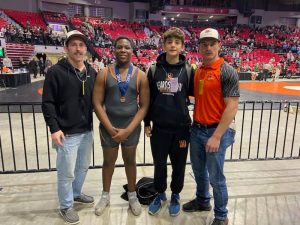 Pictured (L/R) are coach Clayton Thurman, Shadrack Mafhina, Maddox Medrano and coach Colt Hoenes at the IESA State Wrestling Finals.