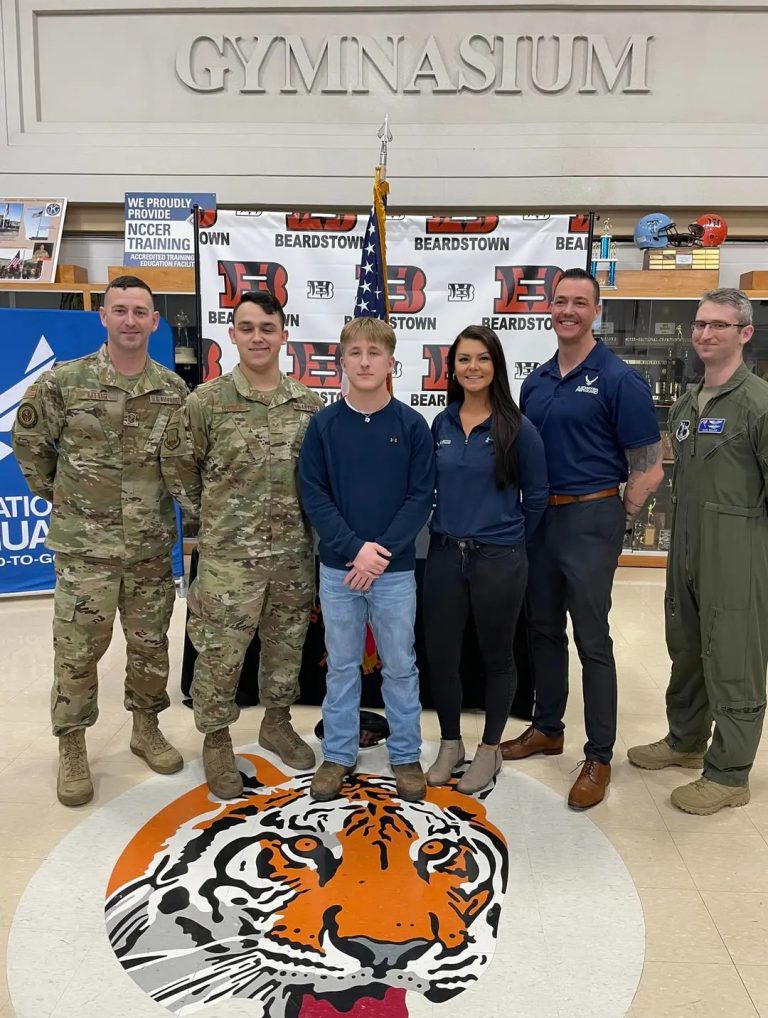 Ryan McClenning (center) enlisted into the 183rd Wing, Illinois Air National Guard on March 23. Ryan took the Oath of Enlistment in front of family, and baseball teammates at Beardstown High School. Ryan is the son of Joe and Bree McClenning, grandson of John and  Kathleen Quigley, Larry and Mary Stoklund, Usa Stoklund,  and the late Mark McClenning.