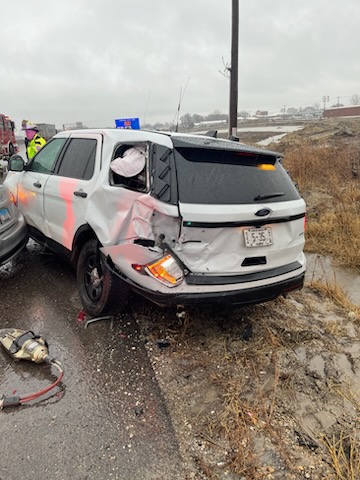 An Illinois State Police patrol car was hit in a crash involving a Beardstown man.