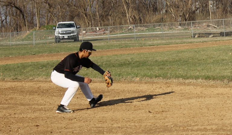 Third baseman Gustavo Cortes snags a grounder for Beardstown during varsity baseball action at Ed Lewis Field.