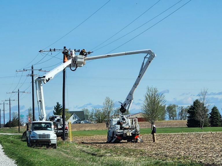 Pictured above, two crews in bucket trucks work to get the lines in order.   Photo by Jaime Chapman