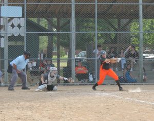 Beardstown’s Emily Nava lines a base hit up the middle during varsity softball action at Bruce Rice Field.