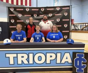 Pictured from left to right is, Jim Bateman (father), Coach Werner, Will Bateman, Coach Black, Stephanie Smith (mother).