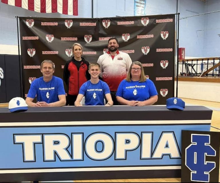 Pictured from left to right is, Jim Bateman (father), Coach Werner, Will Bateman, Coach Black, Stephanie Smith (mother).