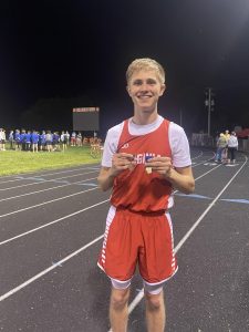 Virginia-Triopia Senior Will Bateman is shown with his first place medal for winning the 400 meter dash at the Beardstown Sectional Meet.  Bateman and several other area athletes will compete at the boys state finals this weekend.