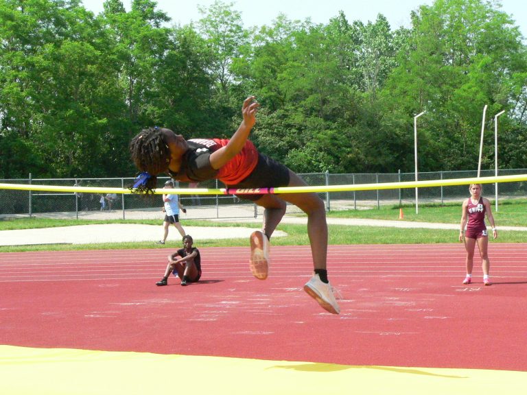 Beardstown’s Jenny Bongo just clears the bar on her way to a runner up finish in the high jump at the IESA State Track and Field Championships.