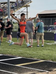 “Flying through the air with the greatest of ease!”  Beardstown’s Diana Huerta is shown mid-flight during the girls Sectional Track Meet.  Her leaping ability has her qualified for the IHSA State Final Track Meet this weekend in both the long jump and the triple jump.