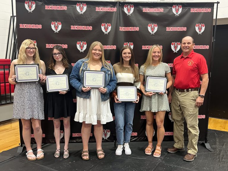 Virginia Masonic Lodge Master Terry Bell (right) presented scholarships to five Virginia High School seniors (left to right): Autumn Harris, $1,000 for vocational education; Kaylee Brown, $1,000; Emily Pratt, $1,000; Megan Reynolds, $1,000, and Gabby Young, $2,200 to be used at Lincoln Land Community College. The Virginia Masonic Lodge and The Illinois Masonic Children’s Assistance Program funded the scholarships. Photo by Steve Cl
