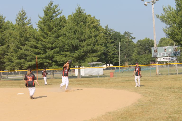 The Beardstown Area Special Athletes Black Attack shortstop makes the over the shoulder catch.