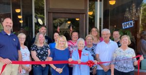 Virginia officially welcomed the Now & Then shop to the south side of the downtown square with a ribbon cutting ceremony. Pictured front row L-R, Thad Walker of Virginia Economic Development, store owners Paula Morris and her mother Kathy Keylor, Mayor Randy McClure, Vickie Bell (VED). Back row L-R, employees Jackie Critchelow and Ronica Carwile, Kenny and Rachel Morris, City Clerk Ashley Cox, Alderman Crista Stanbridge, Cara Bell (VED), and Alderman Kent Andrews.