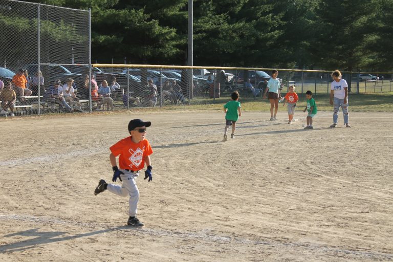This runner is the picture of intensity as he motors his way to first base in Park District T-Ball action.