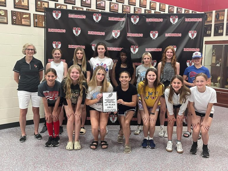 The members of the Virginia-Triopia Junior High Girls Track and Field team are pictured at their season ending banquet with their Morgan County Conference Track Meet Championship Plaque.