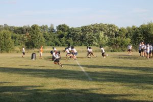 The BHS Tiger offense works against hot air during summer football workouts.