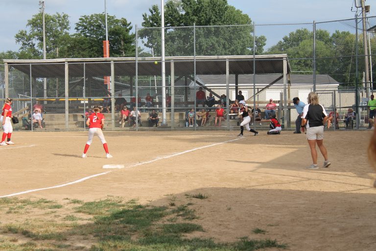 The Tigers' Ola Quigley as she launches a game ending inside the park home run to right center in the opening game of the junior high softball season.