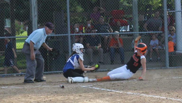 The umpire is right on the call as the Tiger runner is cut down at the plate.
