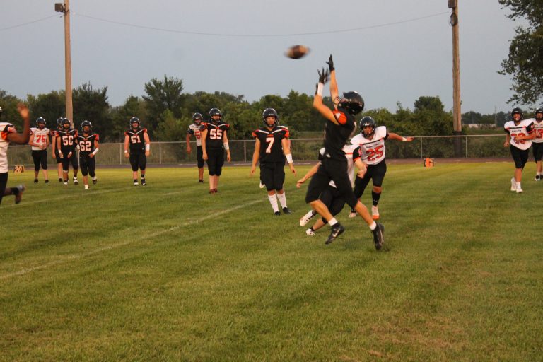Senior Gavin Epping goes up for the catch during the Orange Pride Night football scrimmage.