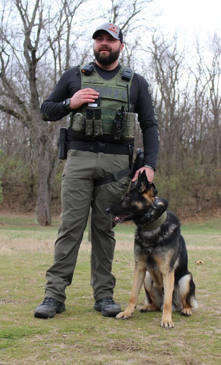 Cass County Deputy Jeff Smith is shown with the county’s K9, Echo. Echo participated in the search for two missing people at Jim Edgar Panther Creek State Park. Echo was overcome by the heat and was unable to continue the search. However, Conservation Police and the sheriff’s department continued the search and located the pair.