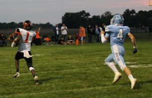 “They’re not gonna catch him!” Elizah Thomas of the Tigers is on his way to a 47 yard touchdown in Beardstown’s win over Triopia.