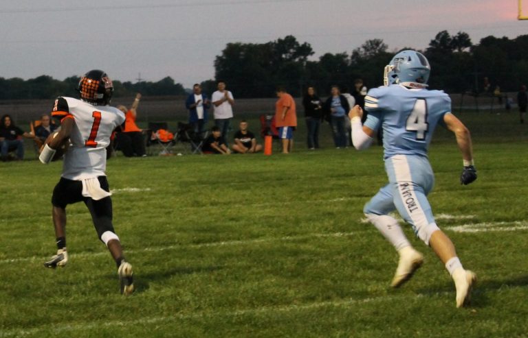 “They’re not gonna catch him!” Elizah Thomas of the Tigers is on his way to a 47 yard touchdown in Beardstown’s win over Triopia.