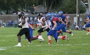 Tiger tailback Christy Domitien turns the corner on his way to a 75-yard touchdown run in Beardstown’s win over Pleasant Hill. Photo by Brockschmidt