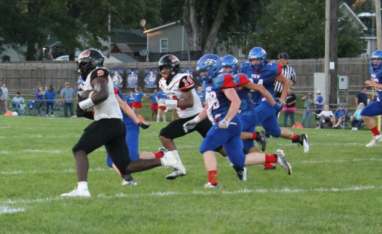 Tiger tailback Christy Domitien turns the corner on his way to a 75-yard touchdown run in Beardstown’s win over Pleasant Hill. Photo by Brockschmidt
