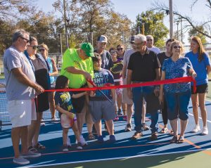 A ribbon cutting was held at Jennie Marr Dunaway Park on the new pickleball courts on Sunday, October 1. Those present in the photo are representatives of theVirginia City Council, Virginia Park Board, economic development and beautification committees. Photo by Kaitlyn Copley
