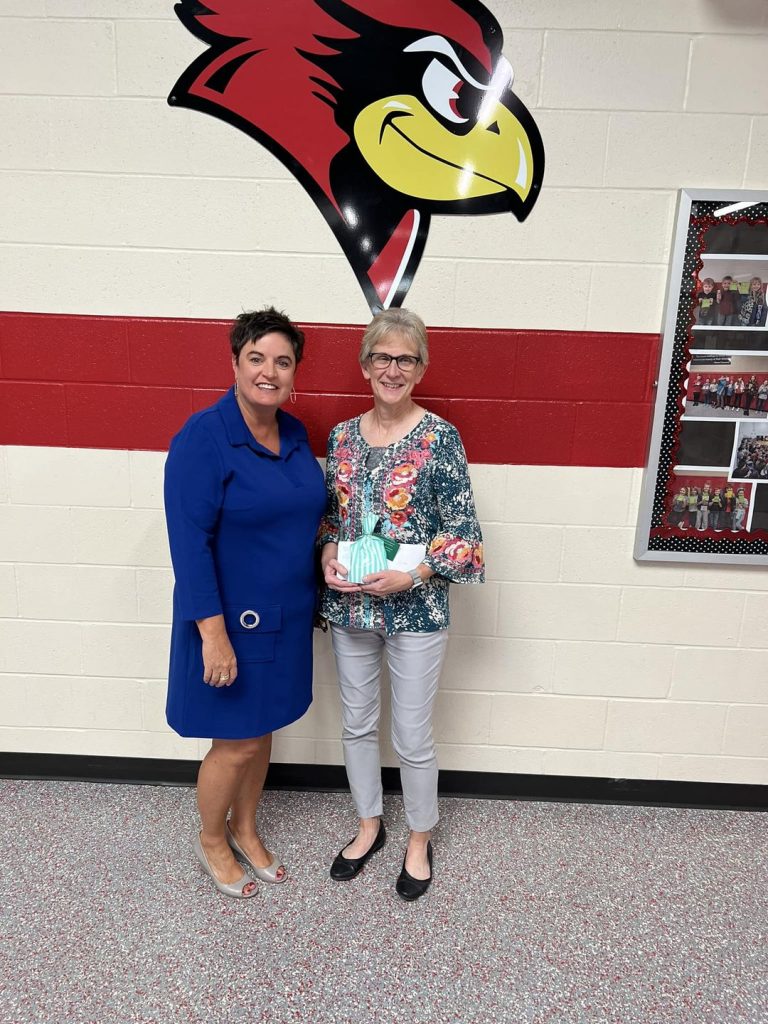 Jamie Berhrends, left, presented Virginia Teacher Linda Brown, right, with a gift card and goodie bag.