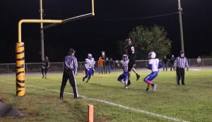 Rylan Alhorn (#9) goes above the defense to make the catch for the two point conversion in the Tigers win over North Greene.