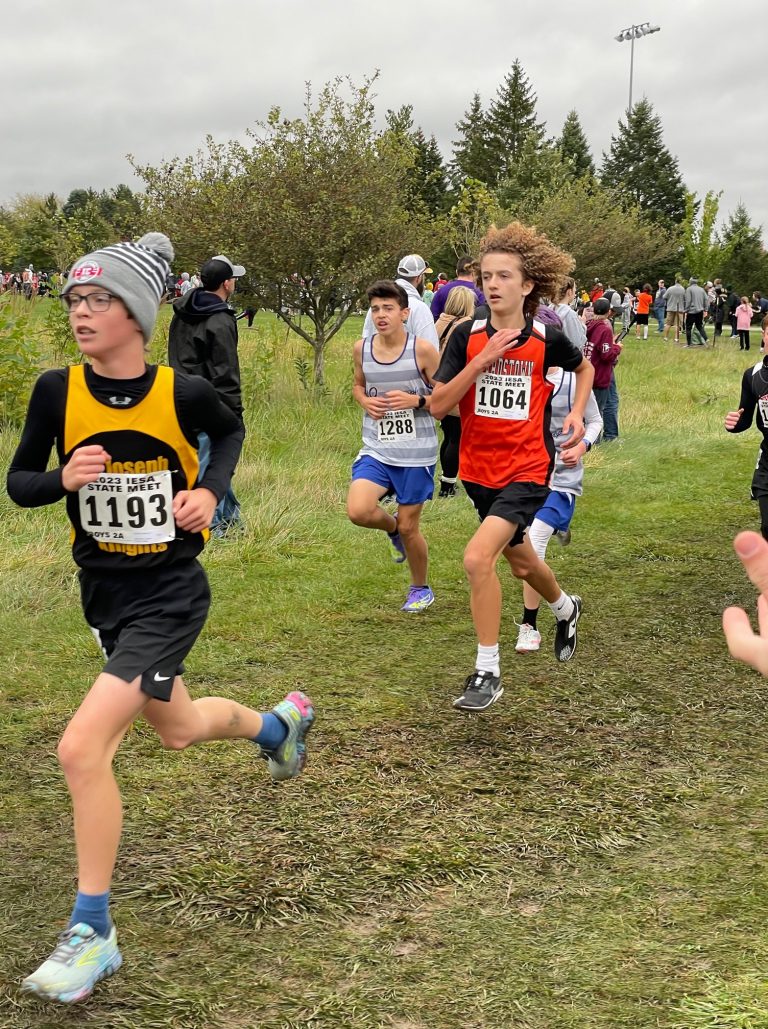 Beardstown’s Liam Hymes races on a slick and muddy course at the IESA State Finals Meet.