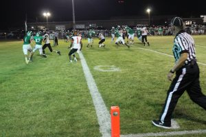 Ethan Heller lowers his shoulder on his way to the end zone.