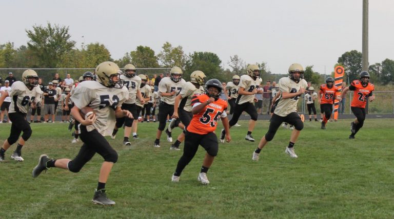 The Tiger defense is in hot pursuit of a Panther from Camp Point in the final junior high football game of the season.