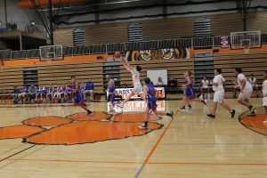 Carter Ross launches a shot from half court as the quarter ends.