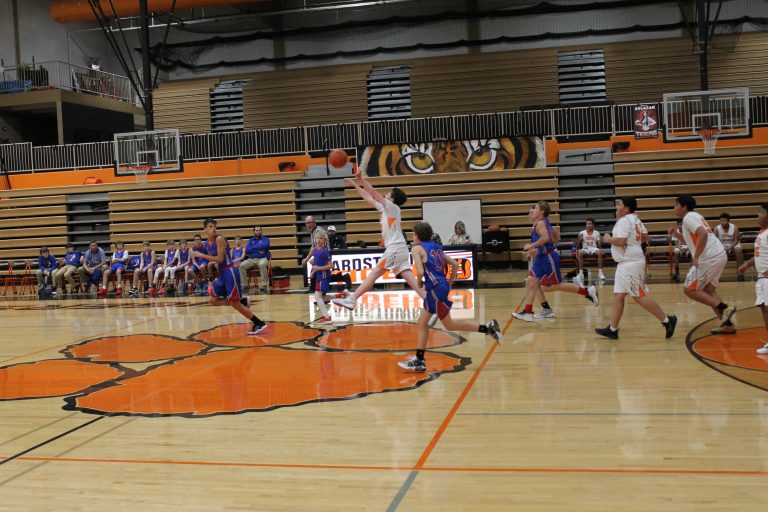 Carter Ross launches a shot from half court as the quarter ends.