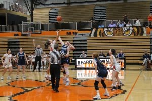 Bella Palmer of Beardstown and Addison Rohn of Triopia go up for the opening tip off.