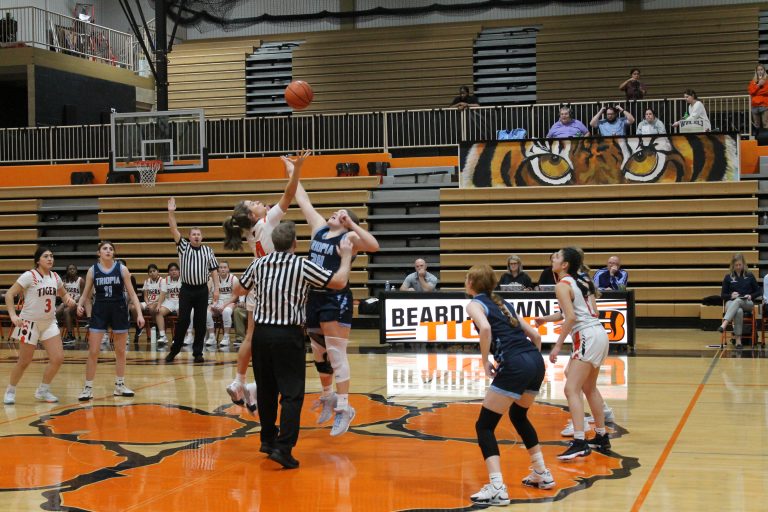 Bella Palmer of Beardstown and Addison Rohn of Triopia go up for the opening tip off.