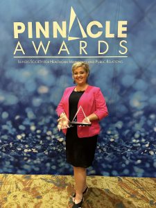 Molly Sorrell, Director of Marketing, Development & Community Relations at Sarah D. Culbertson Memorial Hospital accepts two Pinnacle Awards.