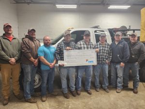 CMFB Board Member Steve Turner presents $950 to Virginia Fire Department shown from left to right; Patrick Williams, Jimmy Stock, Drake Dotzert, Rich Stock,Turner, Steve Dotzert, Zach Virgin, Mike Clement.