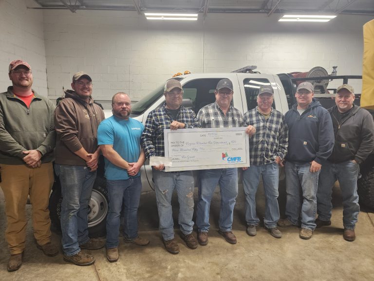CMFB Board Member Steve Turner presents $950 to Virginia Fire Department shown from left to right; Patrick Williams, Jimmy Stock, Drake Dotzert, Rich Stock,Turner, Steve Dotzert, Zach Virgin, Mike Clement.