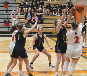 Kylynn Maltby just gets the ball over the outstretched hand of a Panther defender.