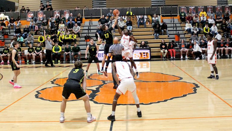Exauce Mulumba goes up for the opening tip for BHS.
