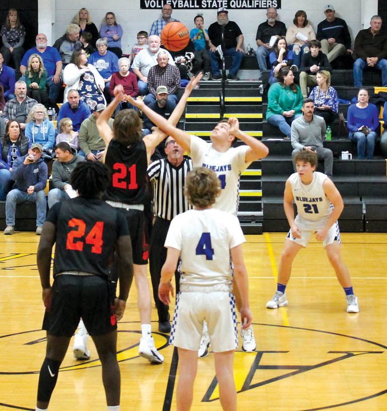 Beardstown’s Rylan Alhorn and PORTA-AC’s Ethan Mahoney tip it off to start the battle between the Tigers and the Bluejays.