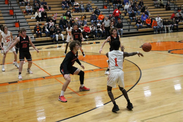 Elizah Thomas moves the ball for the Tigers against the North Fulton zone defense.