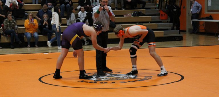 Sportsmanship! Caleb Hobrock shakes hands with his opponent prior to their match.