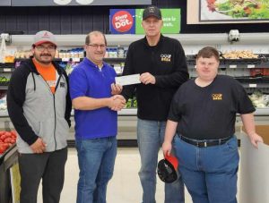 Pictured left to right, Pedro Banda, Niemann employee and BASA athlete, Warden, President Baer, and Phillip Baer, BASA athlete.  Photo by Jaime Chapman