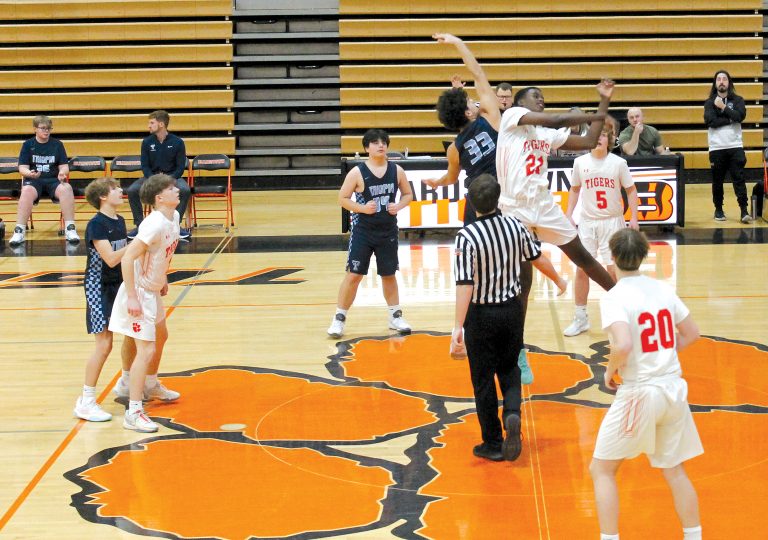 Cleon Djfalo wins the opening tip for the Tiger freshman against Triopia-Meredosia-Virginia.